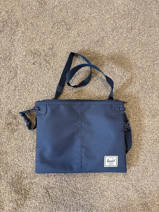 Herschel Supply Company Handbags - Herschel navy blue crossbody bag with red/white striped lining